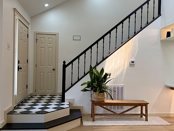 A great view looking back at the entry and cloak closet from the center of the living room.