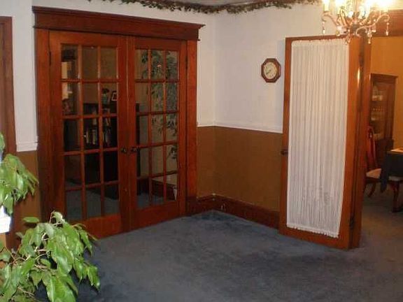 Very large foyer with great old woodwork and french doors