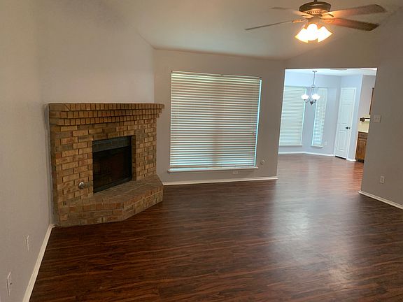 Living Room gas Fireplace and Ceiling Fan.