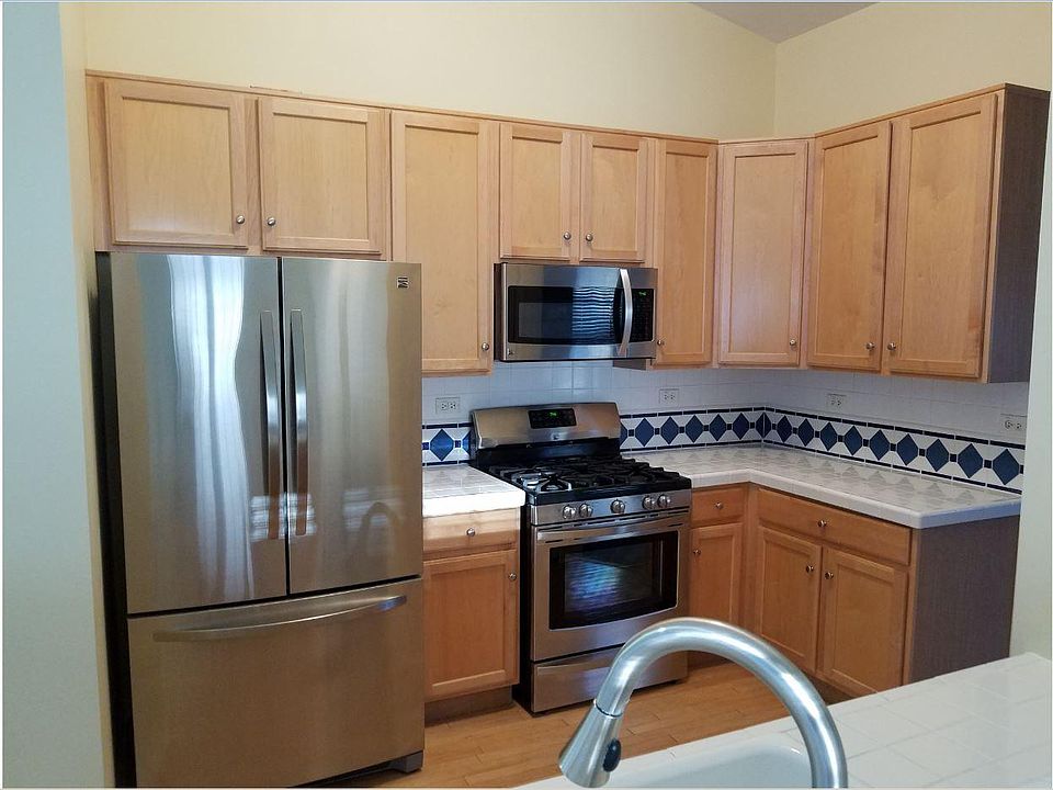 Kitchen - S.S. Appliances and Maple Cabinet