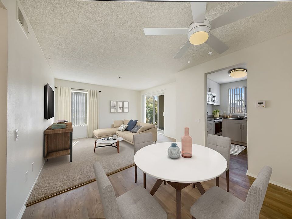 Renovated Package Dining area with hard surface plank flooring and living room with carpet