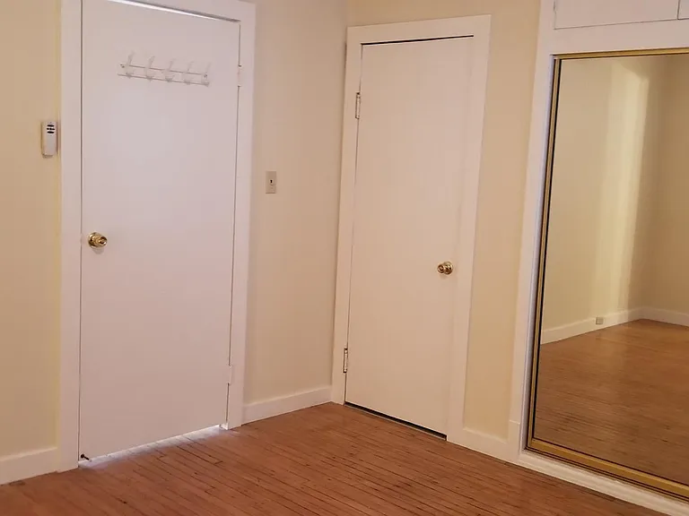 Bedroom w Mirrored Closet