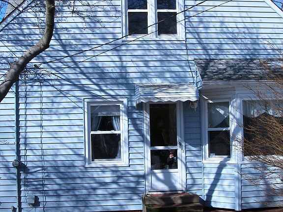 Back view with brick patio area