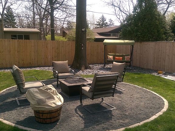 firepit in fenced in yard