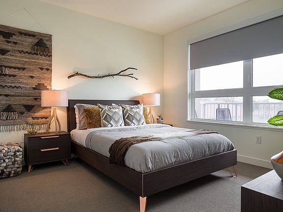 Bright, spacious bedrooms feature neutral tones and lots of natural light; All bedrooms come with black-out shades for a peaceful night's rest.