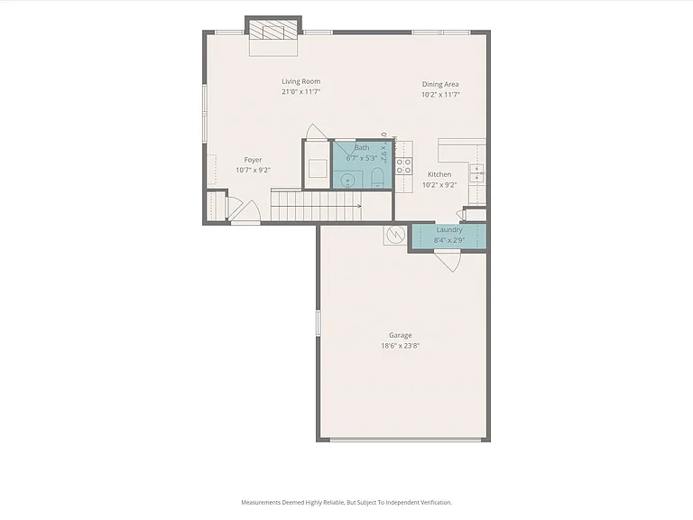 The well-designed first floor offers an open-concept layout with a spacious living room centered around the fireplace, dining area next to the kitchen, powder bath, and laundry room with direct access to the attached two-car garage.