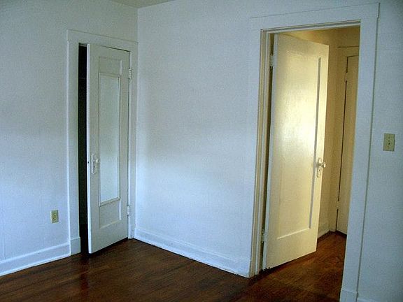 Bedroom towards closet and entrance to room.