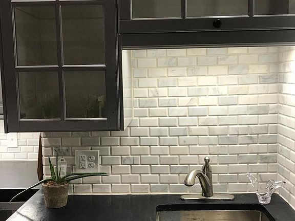 Close up of Sink with Marble Tile