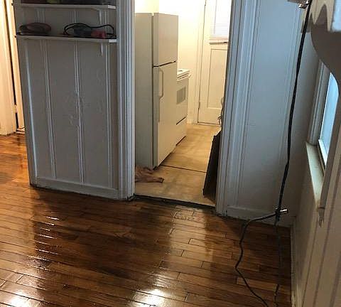 Carpet has been removed from living/sleep area and hardwood floor refinished.