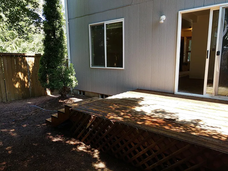 Small back area with deck is excellent for BBQ, reading and relaxing.