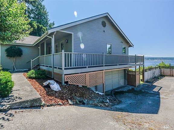 The north side of the home features an almost hidden two-car garage entry.  