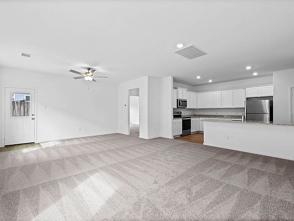 The spacious family room is perfect for hosting!