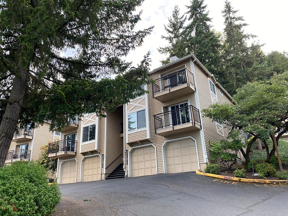 Entrance to the complex. Each condo has its own address. There are visitor parking spots within steps of the listing. There's also a sport court for all to use.