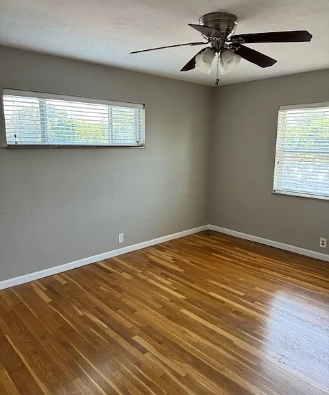 This bedroom is large enough to hold a king size bed, nightstands, large dresser and chair