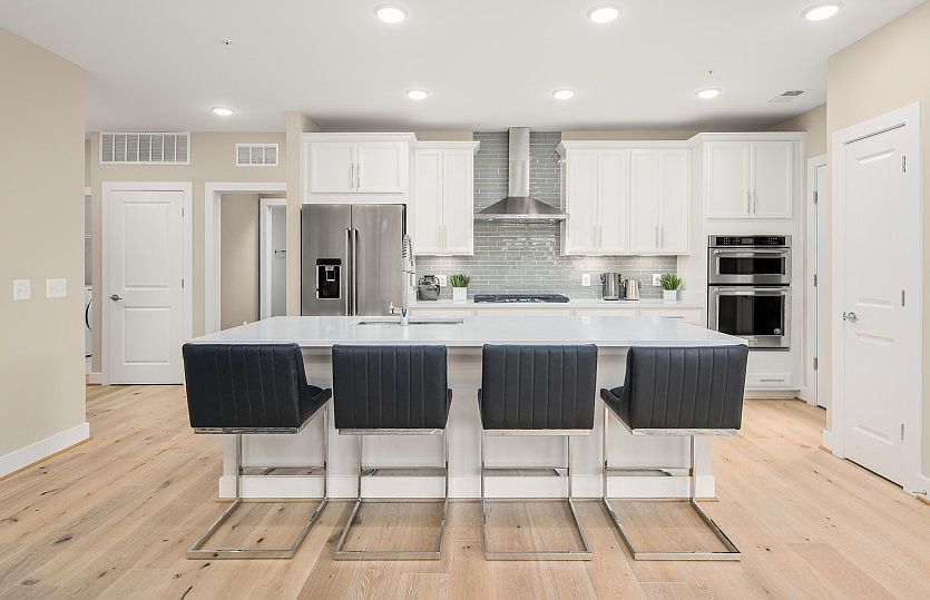 Model Representation - Gourmet Kitchen with Quartz Countertops, Hardwood Flooring and Stainless Stee