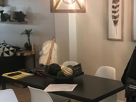 Dining area staged. Hanging light will remain.
