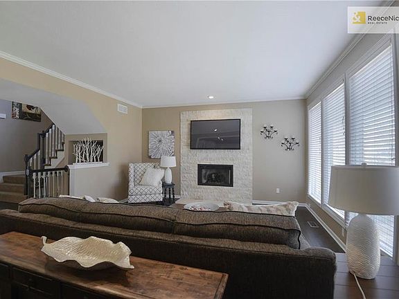 Great room w/ hardwood floors, fresh paint @ remodeled fireplace