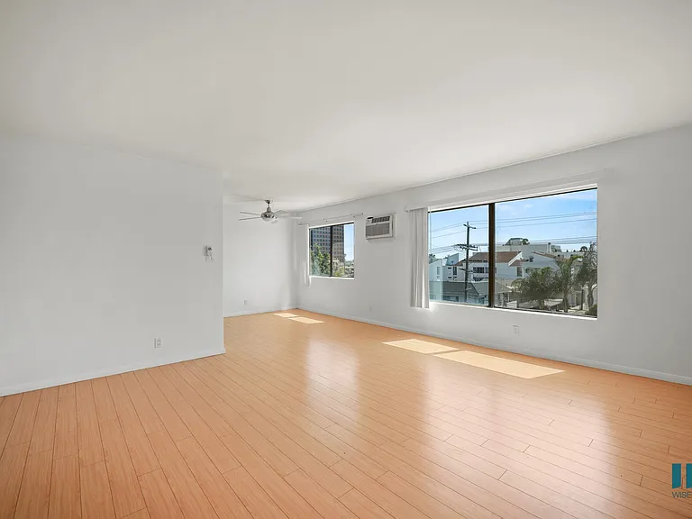 Large-Size Open-Concept Living and Dining Room with Natural Light and Vinyl Flooring