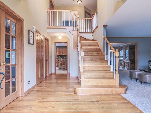 Welcome to your Two Story Grand Foyer. Updated paint, hardwood flooring and upgraded light fixture.
