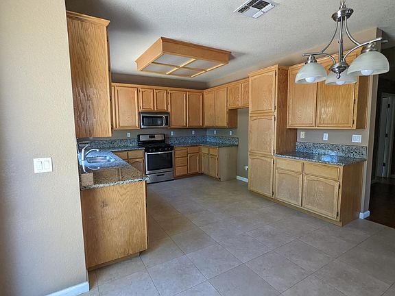 tile kitchen flooring with granite counter top