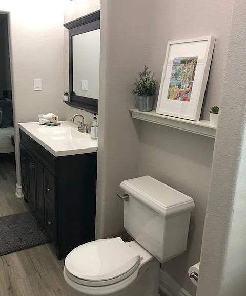 Full bathroom off the master and it is jack and jill style with an entrance also from the living room. It also is where the washer/dryer are stored as well.