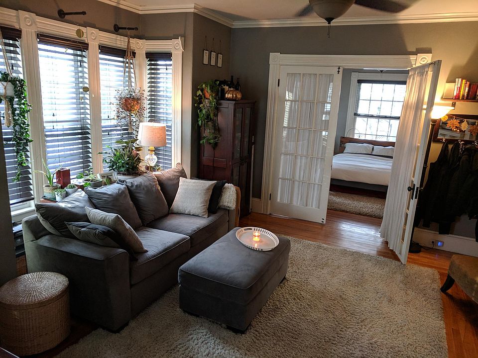 Living room w/ front bedroom in background.