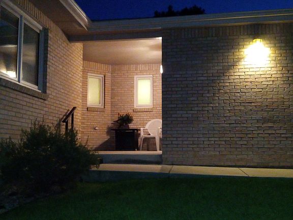 Night time view of main level front entry