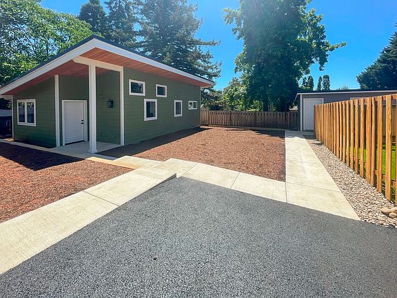 Front yard and dedicated parking spot