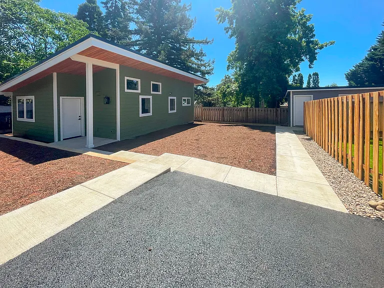 Front yard and dedicated parking spot