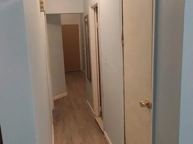 hallway of 1st and 2nd bedroom + bathroom and pantry cabinet