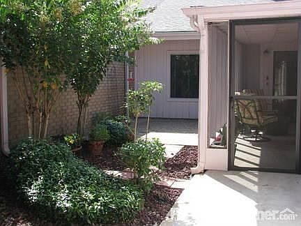 65 Cayenne Common : Private landscaped courtyard leads into cool screened patio: perfectly peaceful!