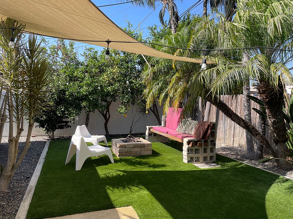 Beautiful backyard with gas fire pit, windsails & outdoor lighting