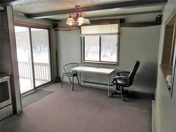 Glass sliding doors in the kitchen lead to the great 18 x 8 ft covered back porch.