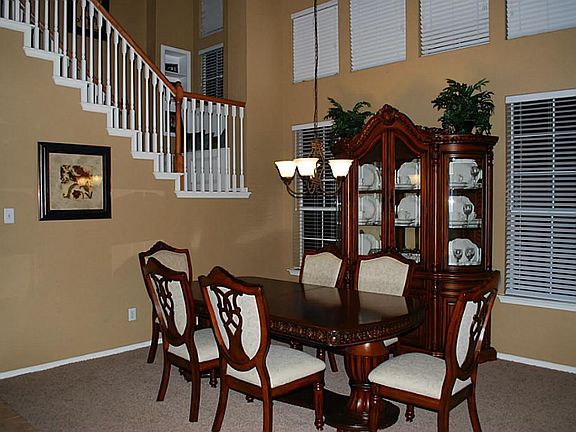 2 Story Dining Room that will likely fit any table. Everyone is welcome at this Dining Table!