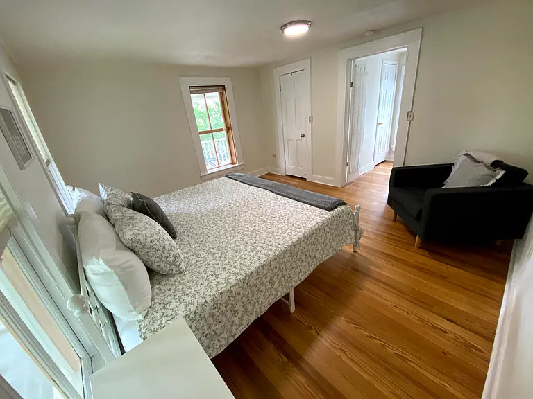 Upstairs east bedroom with comfy chair.