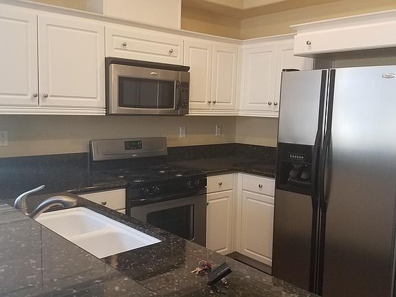 Stainless steel appliances, granite counters and lots of storage.