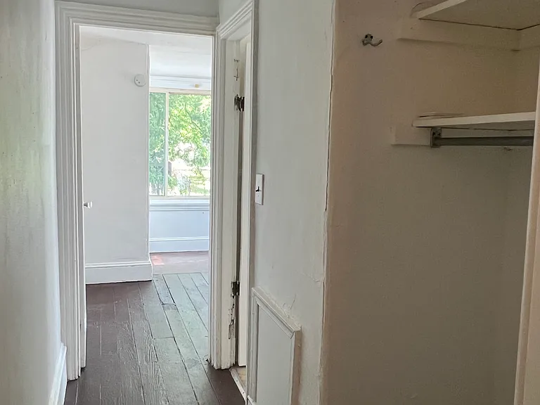 Hallway to bathroom and Den