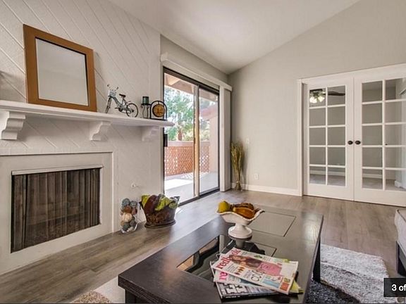 Living room with large balcony (left) and 3rd bedroom (background)