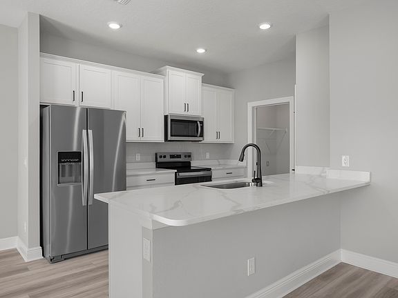 The spacious kitchen is perfect for preparing your family s favorite meals and treats.