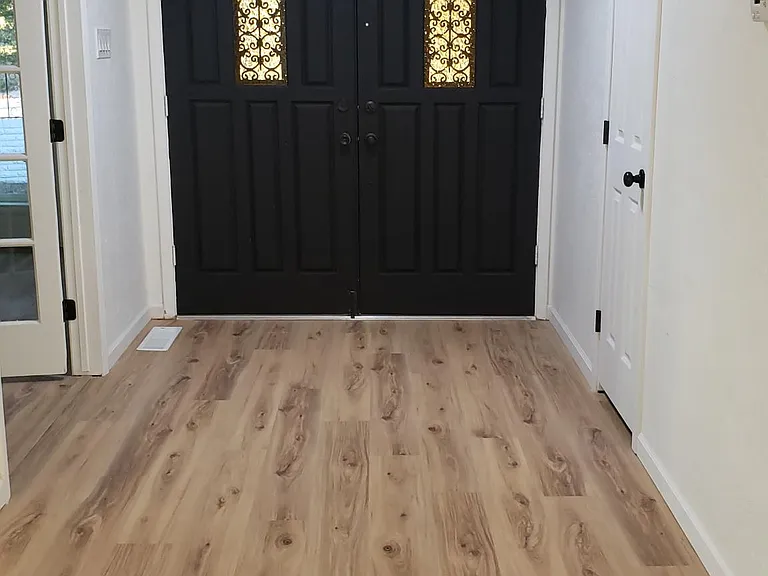 Entryway. French doors leading to formal dining to the left, small entry closet door to the right