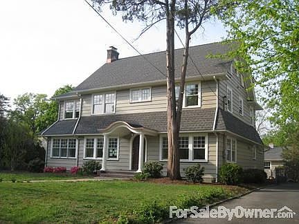 Rear Facade
						:
						Showing cedar deck with double sliding French-doors.