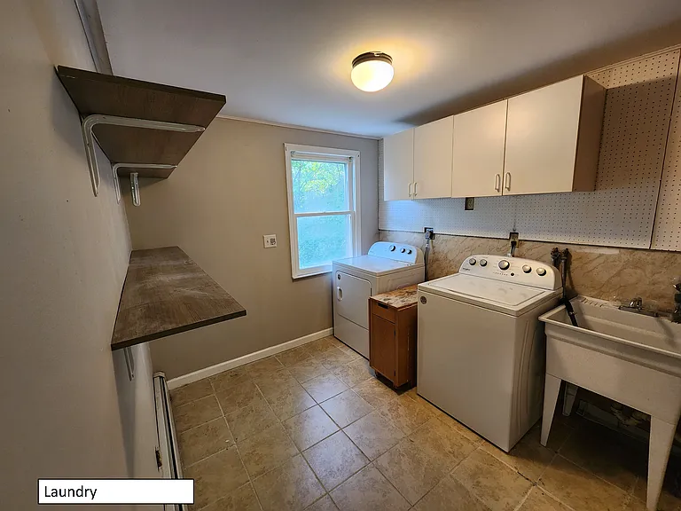 Laundry room, located off kitchen, can be used as pantry as well.