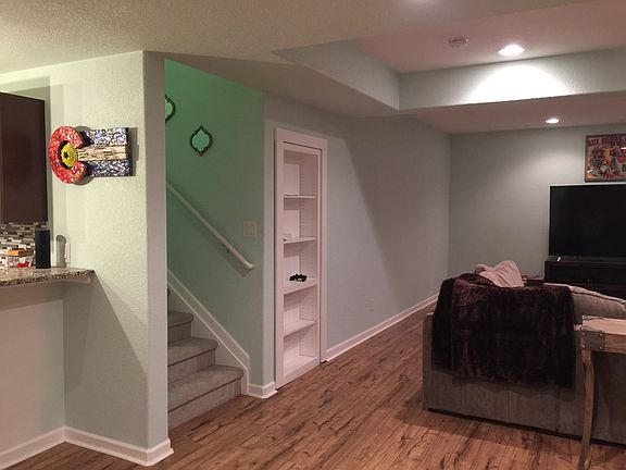 Basement, bookshelf is door 