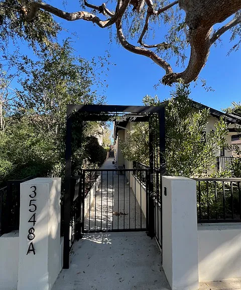 electronic gated entry, front door to ADU is toward end of walk way