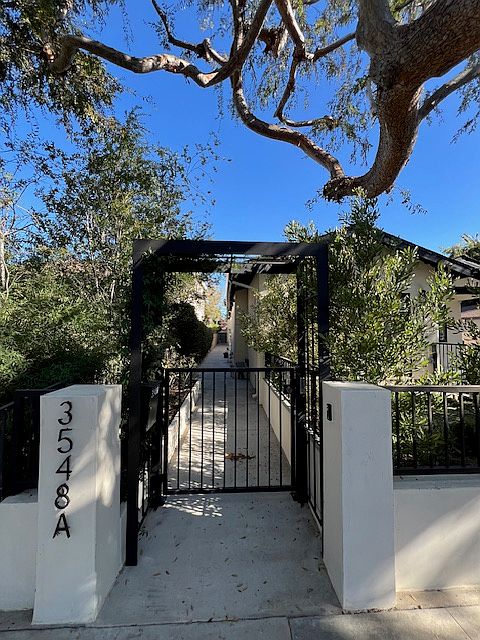 electronic gated entry, front door to ADU is toward end of walk way