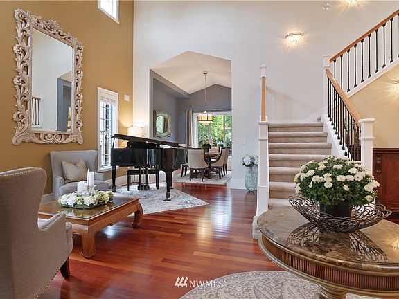 View from front door. Living room, diing room. Lots of windows to let the natural light in. Hardwood floors. 