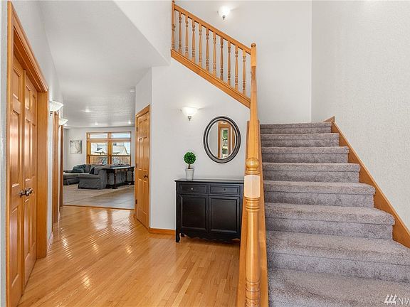 View from the foyer. Home office, 1/2 bath and laundry room to the left. Living room to the right and great room straight ahead.