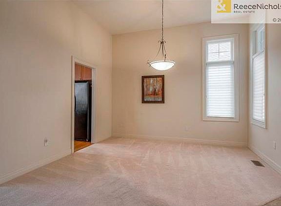 View of dining and peek into expanded kitchen.  Carpets are freshly cleaned!
