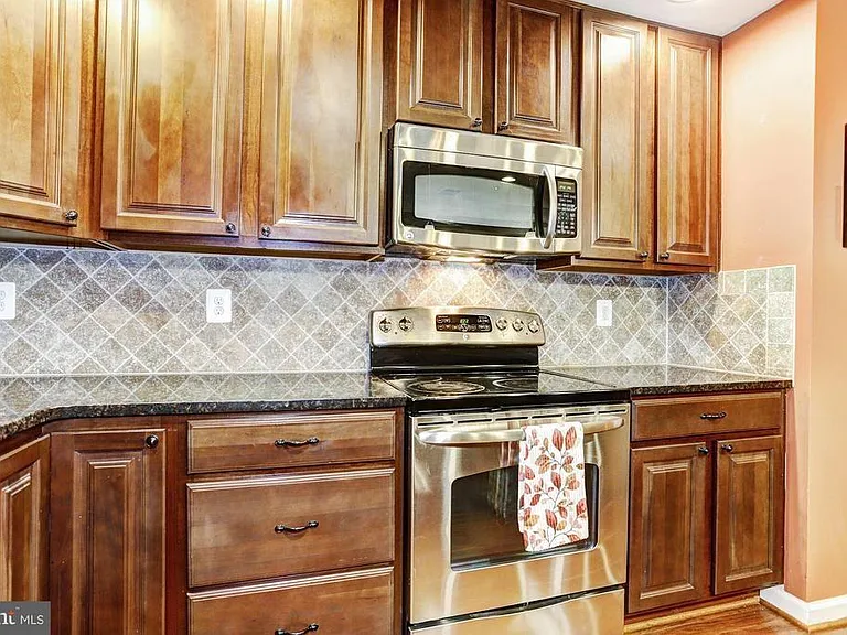 Updated kitchen with stainless steel appliances.
