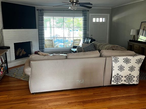 Living space with fireplace and picture window